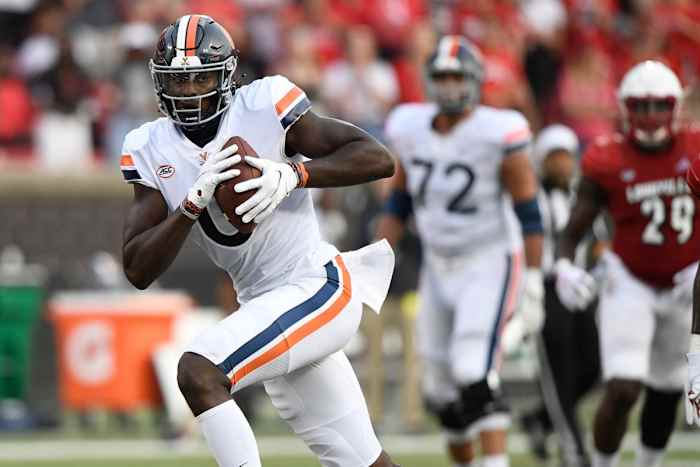 Oct 9, 2021; Louisville, Kentucky, USA; Virginia Cavaliers tight end Jelani Woods (0) runs the ball against the Louisville Cardinals during the second half at Cardinal Stadium. Virginia defeated Louisville 34-33. Mandatory Credit: Jamie Rhodes-USA TODAY Sports